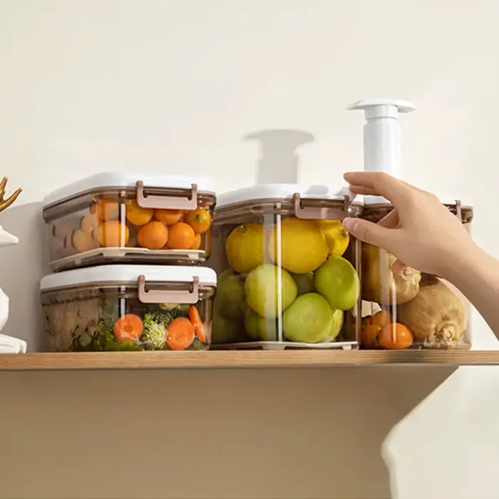 Boîte de conservation alimentaire sous vide avec plaque de drainage amovible