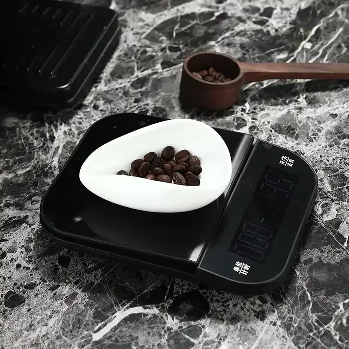 Tasse à mesurer les grains de café