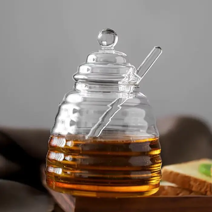 Récipient de stockage de miel précieux en accent d'abeille en verre avec louche et couvercle