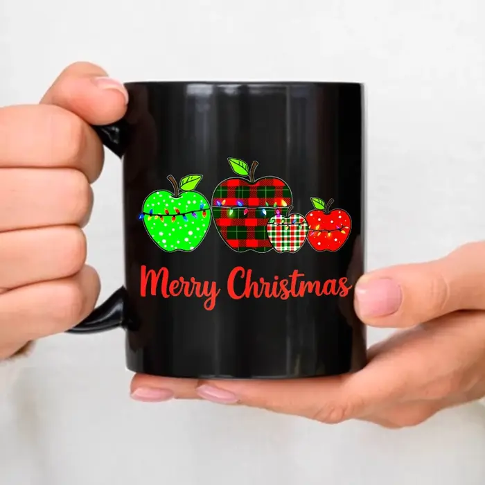 Tasse à café noire avec motif pomme de Noël et texte "Joyeux Noël"