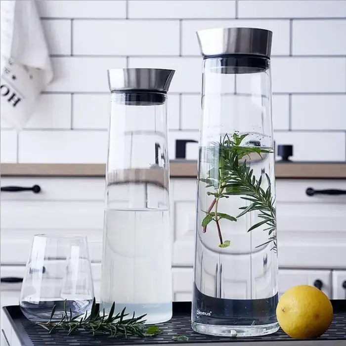 Grande bouteille d'eau en verre épaissie avec couvercle en acier inoxydable